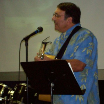 Pastor Dick leading worship in Lubbock, TX