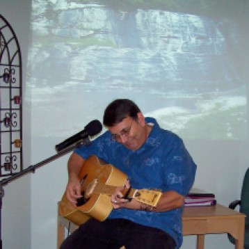 Pastor Dick playing his guitar before our 2nd seminar in Albuquerque